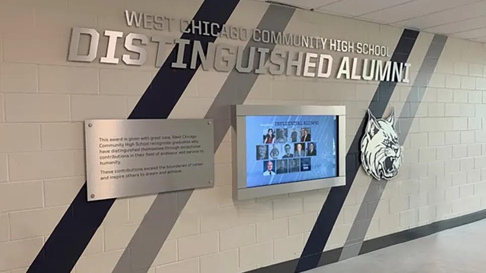 A digital hall of fame display celebrating a school athletic program.