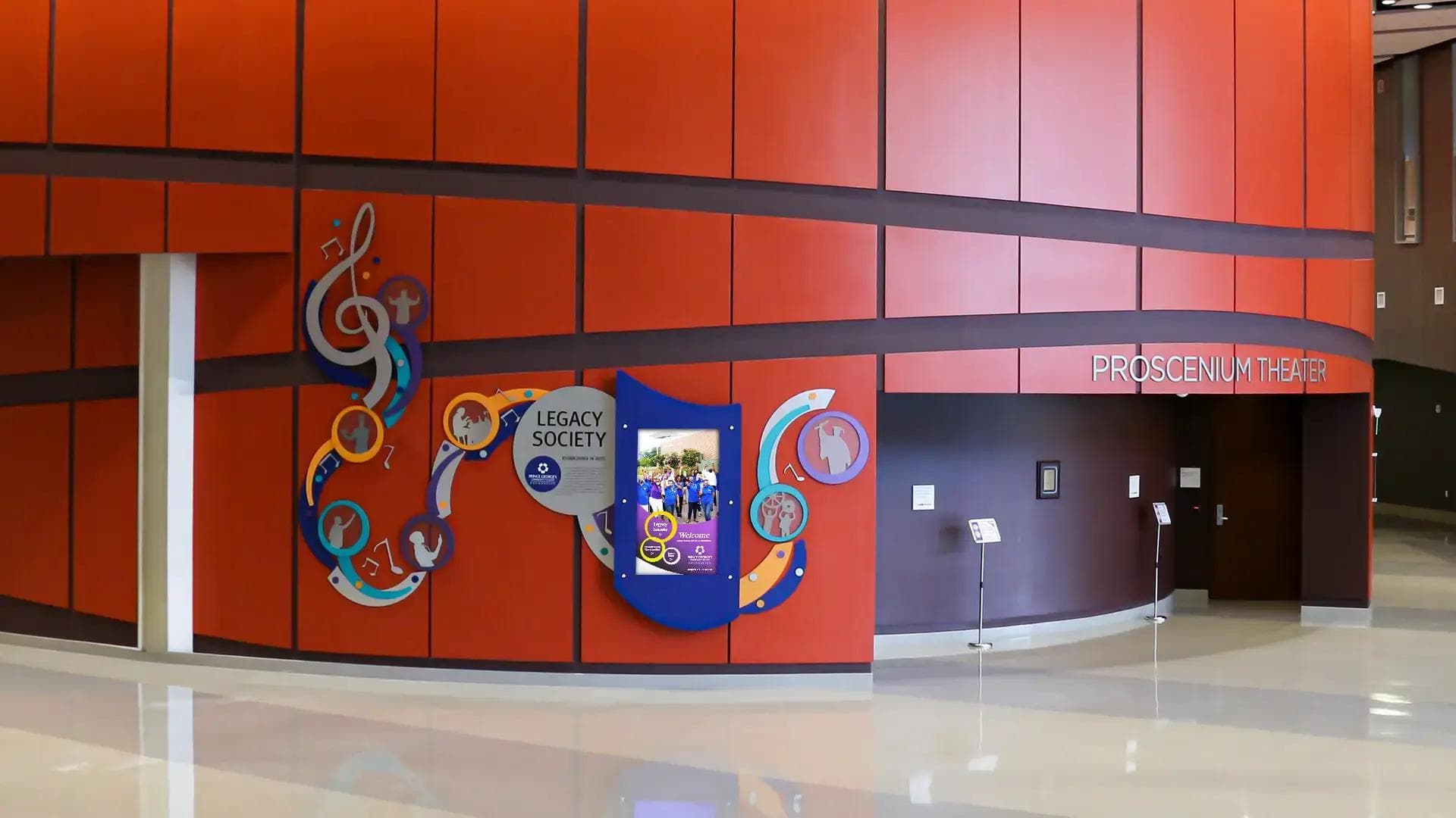 An interactive digital donor wall at a college performing arts center.