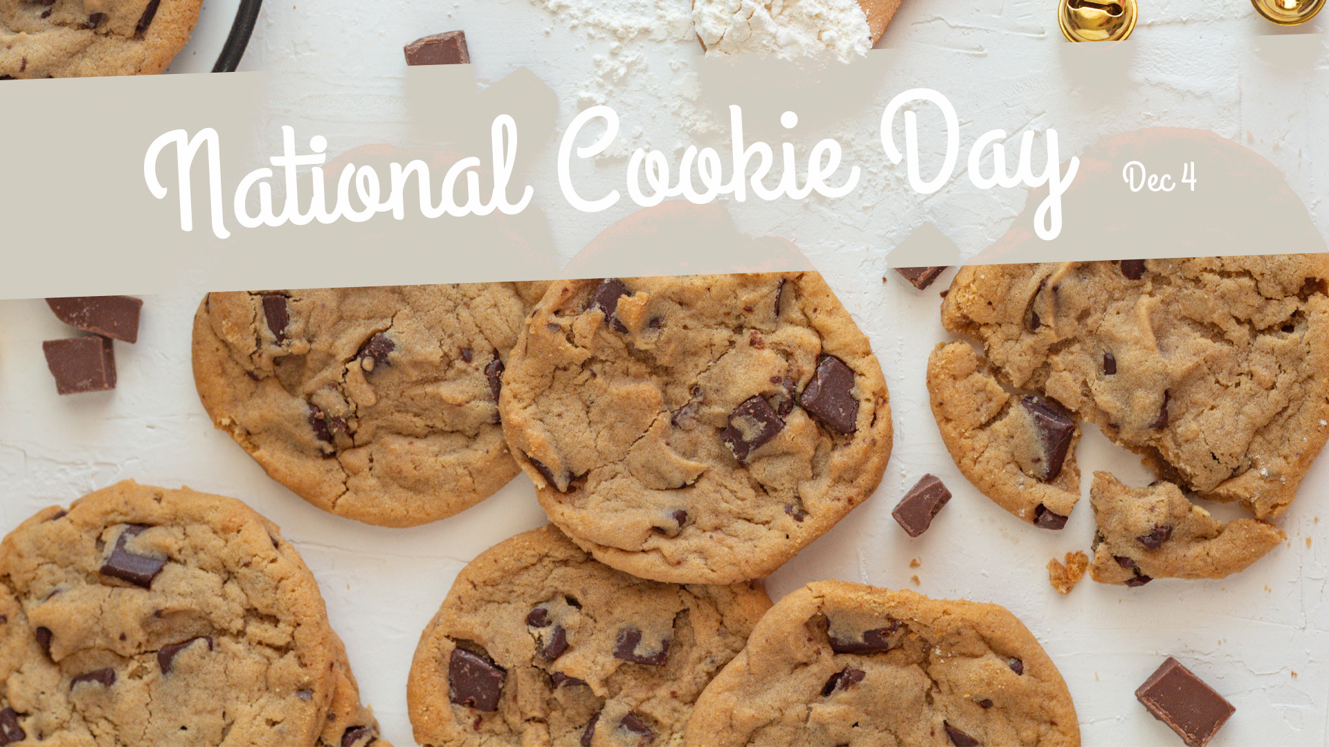 National Cookie Day spread across the top of the screen on a tan banner. The background is a photo of freshly baked chocolate chip cookies laying out.