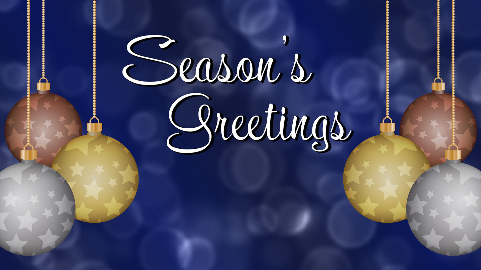 Navy blue background with transparent white circles. 2 groups of 3 gold, bronze, and silver circular ornaments with stars on them on both sides of the graphic with a white script font saying Season Greetings
