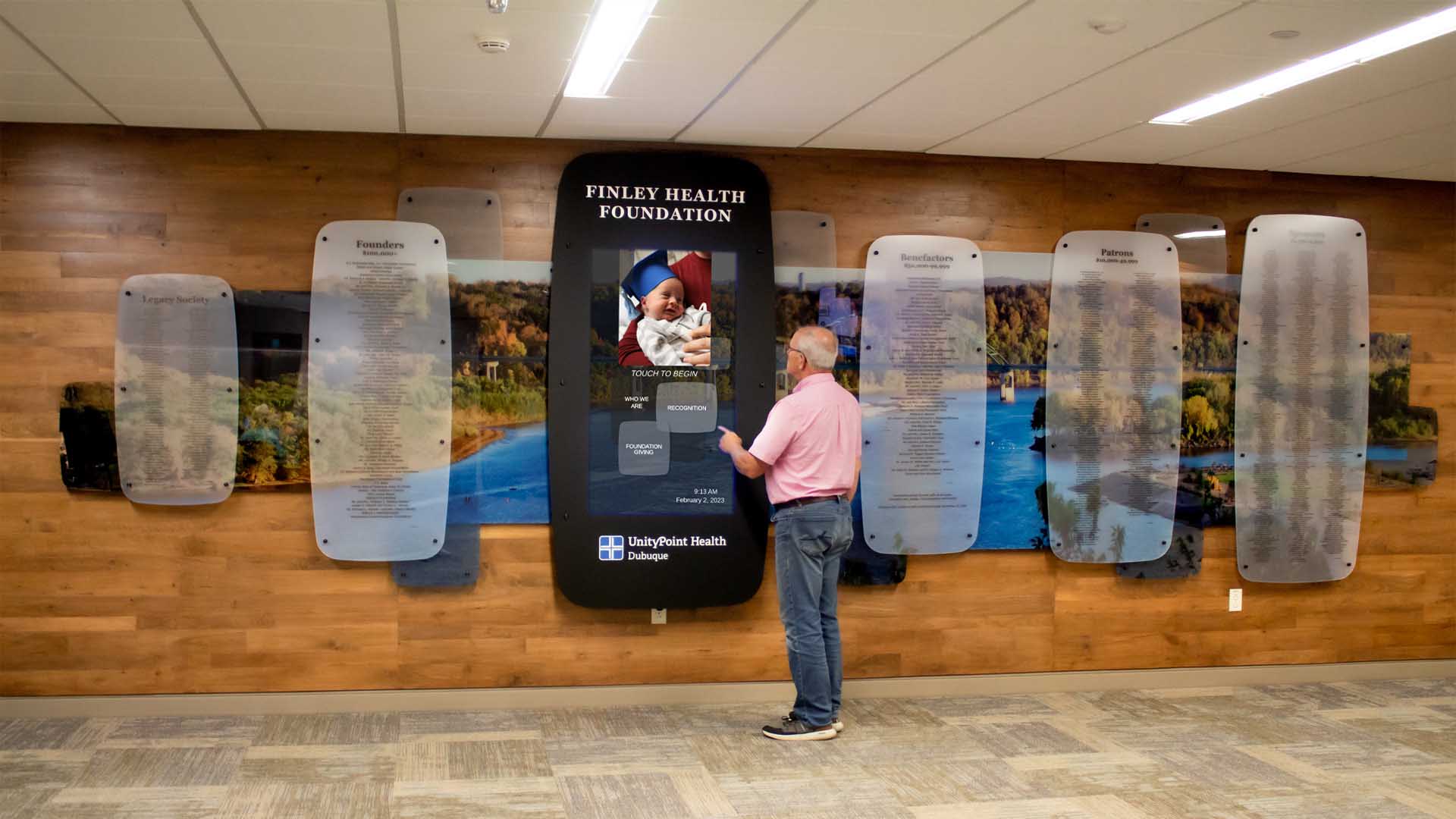 Interacting with the digital donor recognition display at a hospital