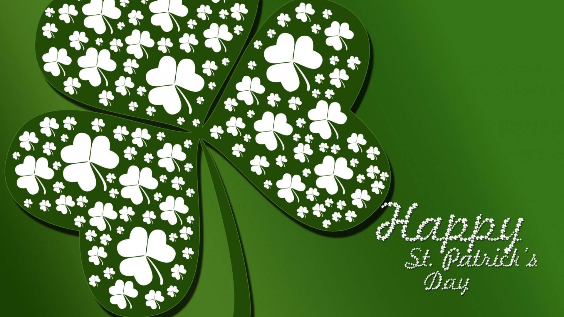 Green Gradient background with a large shamrock extended off the screen. Happy St Patrick's Day spelt out in the bottom right corner of the graphic