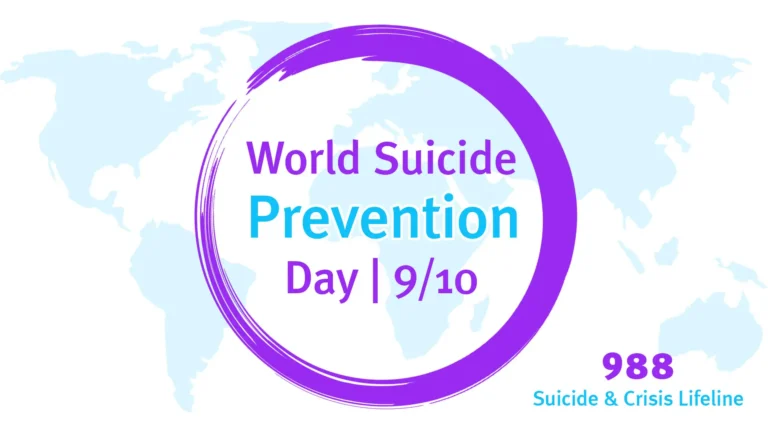 A map of the world where the continents are light blue on solid a solid white background fills the image. In the center is a bright purple painted circle outline. In the circle reads 'World Suicide Prevention Day | 9/20' The bottom right corner has bold numbers '988' and below 'Suicide & Crisis Lifeline'. 'World Suicide', 'Day | 9/10', and '988' are in purple, sans font. 'Prevention' and 'Suicide & Crisis Lifeline' is in blue, sans letters.