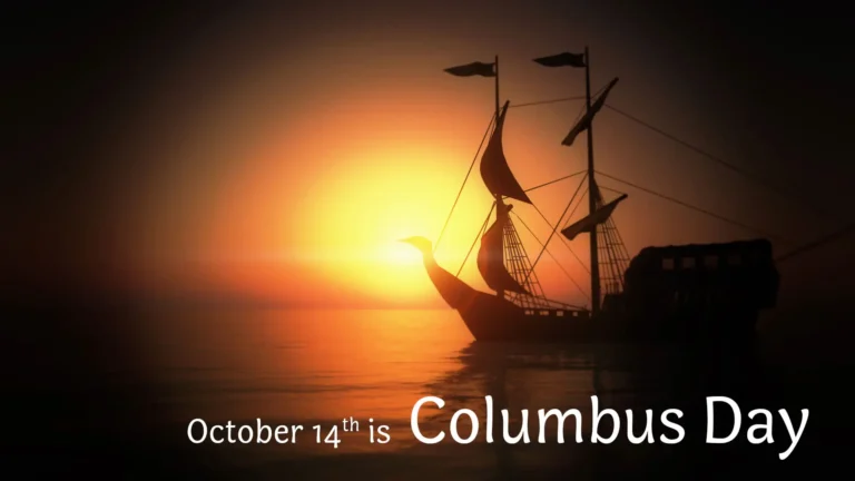 A photo of the silhouette of an old ship with sails floating in front of an orange and yellow sunset that fades out to brown. Across the bottom edge, in the center to bottom right corner, reads ‘October 14th is Columbus Day’ in white, round, sans letters.