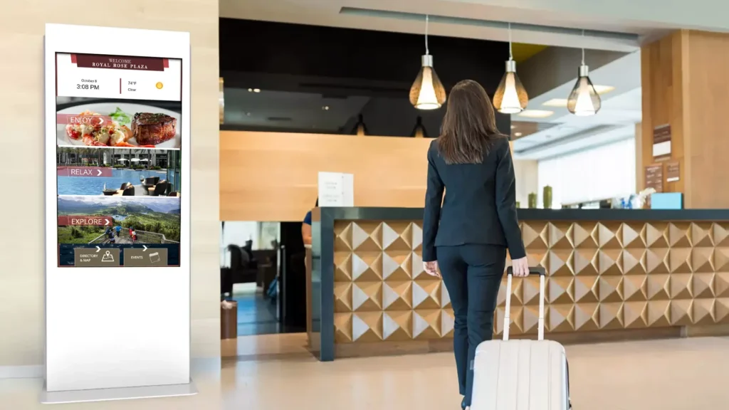 customer stands in front of bar with digital signage