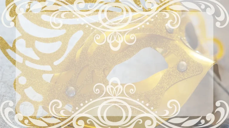 A close up photo of a golden paper mask on a white background. Over top a transparent, white, rectangle fills the center of the image. White, swirling, decorative images cross the top and bottom edges.