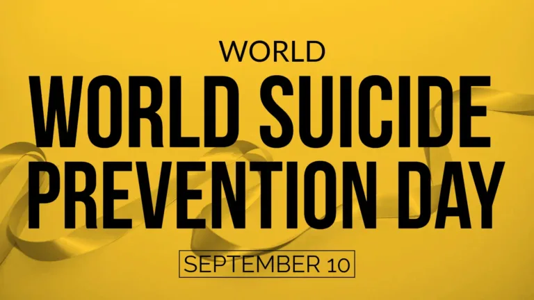 A photo of a strip of ribbon crosses near the bottom edge horizontally. A bright, gold-yellow color is overlaid over the photo and makes the background solidly that color. ‘The words World Suicide’ and ‘Prevention Day’ are are stacked and fill almost the entire image, just leaving a little above and below them. The words use a bold, black, all-caps sans font. In smaller and thinner, black letters above the large words says, “WORLD.” Below everything, in a similar thin size and font, is the date September 10. The date has a thin black rectangle border around it. The date and ‘World’ are centered on the graphic.