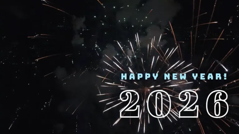 A video of fireworks against a black sky. In the bottom right corner slides in bold, blue, sans letters saying, “HAPPY NEW YEAR.” Below the message, in large, seif numbers is 2026. The numbers are transparent with a bold white outline.