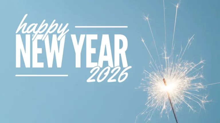 A photo of a lit sparkler in the bottom right corner. The entire background is a bright, light blue sky. Left of the sparkler and taking up the rest of the image are large words. The largest words, “NEW YEAR” are in the center of the stacked words. It uses a bold, sans font. The word ‘happy’ sits on top of the word ‘NEW’ near the top left corner. The year 2026 sits below the word YEAR. A medium cursive font was used for both smaller words. A thin horizontal line stretches from the right of happy and left of 2026, and reaches the ends of New Year. Everything is colored white.
