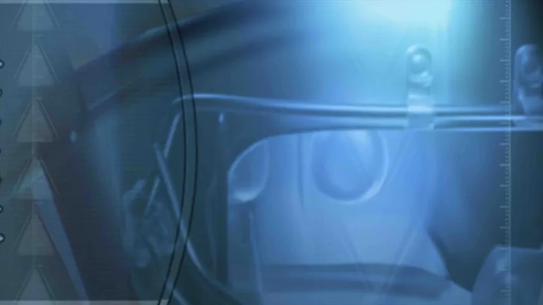 A digitally made video that has a close up rotating football helmet, football, and triangles overlapping and moving around. The video is color graded to be blues and blacks.