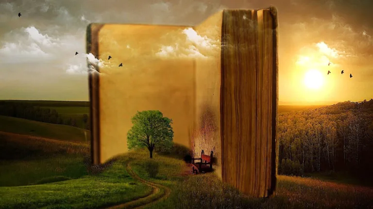 A digital collage image of a hilly, green landscape at sunset. A large, old book sits open with blank pages showing. The book is taller than a building would be. Is sits on the grass and goes up into the sky where clouds pass around it. On the ground, in front of the open book pages is a small hill with a tree and a wooden chair.