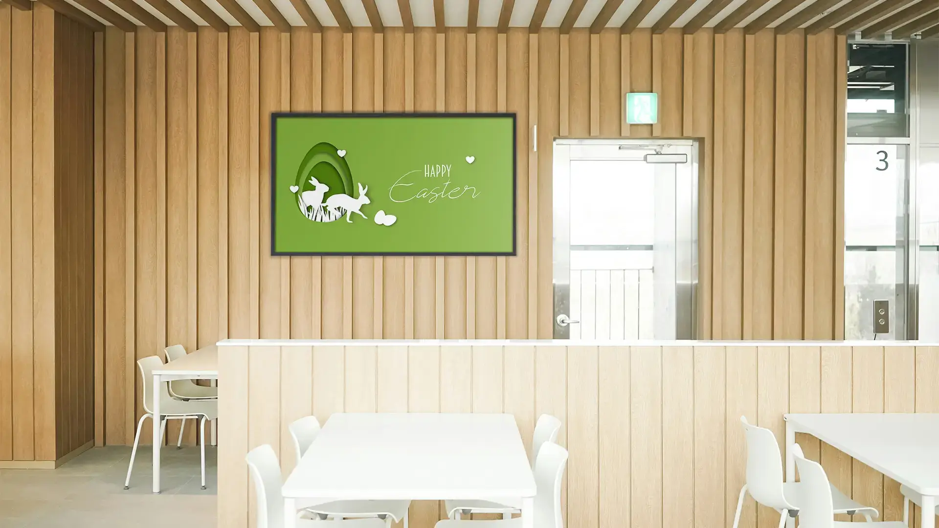 A restaurant with modern wood paneling and a screen that has a 2026 Arreya Free graphic on it for Easter.