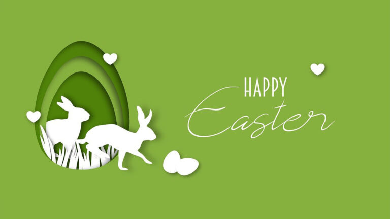 A solid, bright green background with an egg shape cut out of it on the left. The cut out reveals three more layers of different shades of green paper also in egg shapes. Two, white rabbit silhouettes are climbing out of the egg cut out. There is white grass at the bottom of the egg cut out. Two white eggs sit just in front of the rabbits. Three white hearts are floating above everything. In the right are two stacked words. At the top is 'HAPPY' in small, white sans letters. Then 'Easter' in large, thin, white, cursive letters.