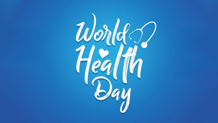 A blue background that becomes lighter in color in the center of the graphic. In the center are three large, stacked, white, handwitten words: World, Health, Day. A white stethoscope icon is to the left of 'world.' A small, white heart is over the 'e' and 'a' of 'health.'