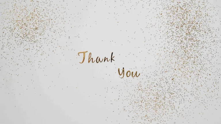 The words 'Thank you' are made of small, metallic gold letters that are sitting on top of a solid white surface. Small gold confetti falls down around the words.